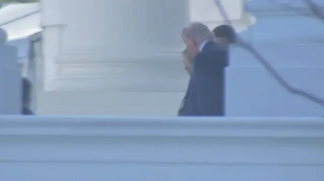 A far-away photo of Trump and Pam Bondi departing the White House