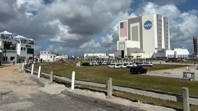 A cloudy sky hangs over the Nasa building