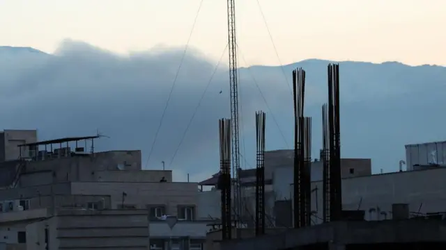Smoke rises over buildings in Tehran on Wednesday morning.