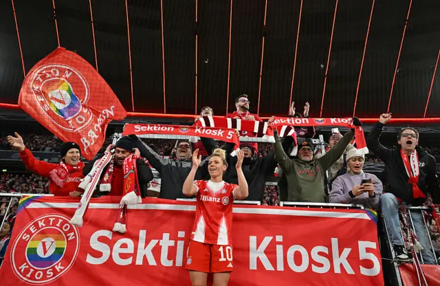 Bayern players celebrate in front of the fans after the game