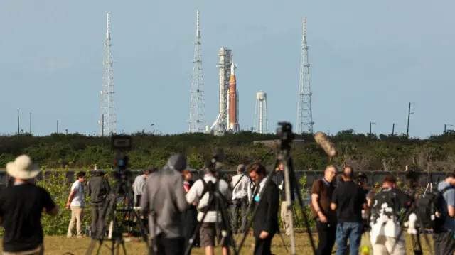 People gather to watch the Artemis II mission launch at the Kennedy Space Center in Cape Canaveral, Florida