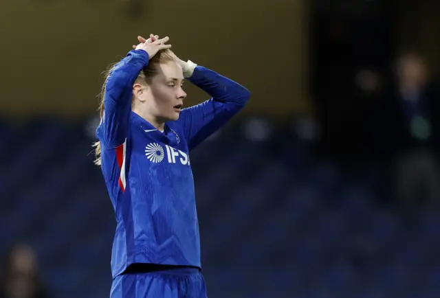 Nusken puts her hands to her head after missing a chance