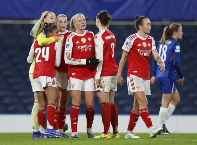 Arsenal players celebrate at full time