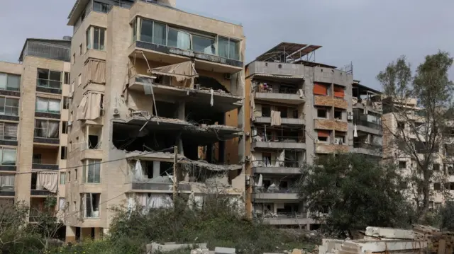 A damaged block of flats in Hadath