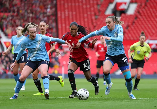 Vivianne Miedema and Lauren Hemp of Manchester City in action with Jayde Riviere of Manchester United