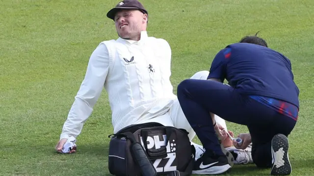 Kent's Matt Parkinson receives treatment during a game last season