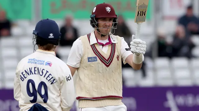 Craig Overton raises his bat