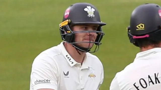 Jamie Smith fist bumps Ben Foakes while batting for Surrey