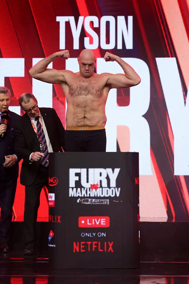 Tyson Fury weighs in and flexes his muscles