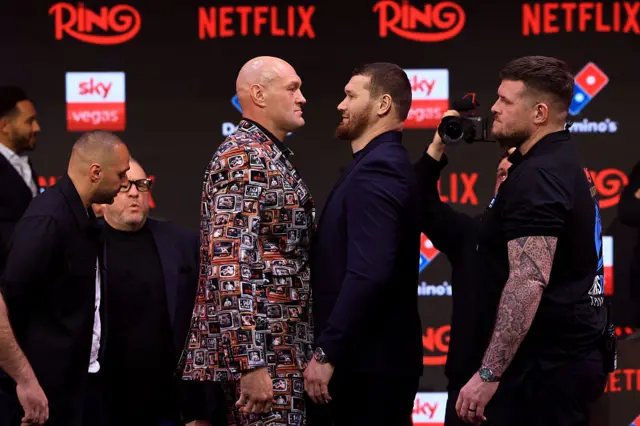 Tyson Fury and Arslanbek Makhmudov stare are each other