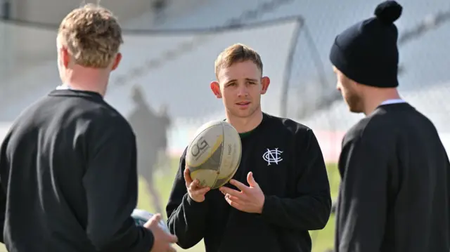 Nottinghamshire's Jack Haynes holds a rugby ball in the warm-up before the game with Glamorgan