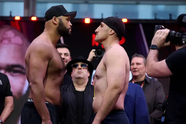 Frazer Clarke faces off with Justis Huni at a weigh-in