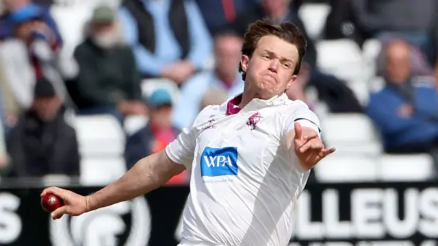 Josh Shaw prepares to release the ball as he bowls for Somerset
