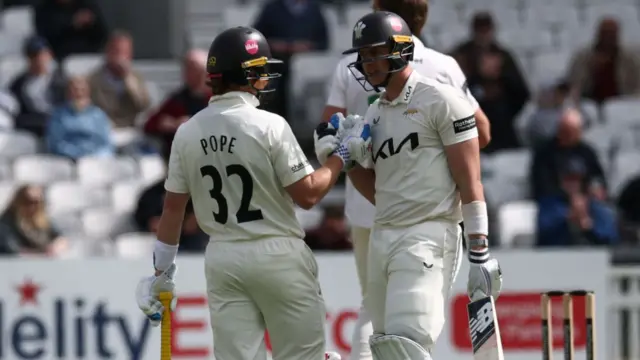 Jamie Smith and Ollie Pope fist bump while batting for Surrey