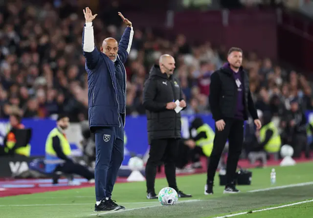 Nuno waves his arms in the air
