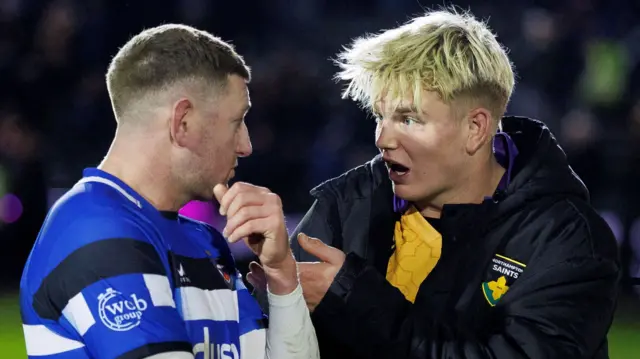 Finn Russell and Henry Pollock talking