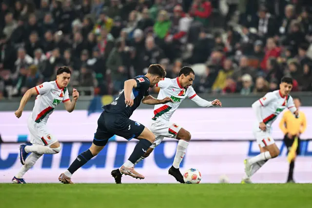 Alexis Claude-Maurice of FC Augsburg is challenged by Robin Hranac of TSG 1899 Hoffenheim