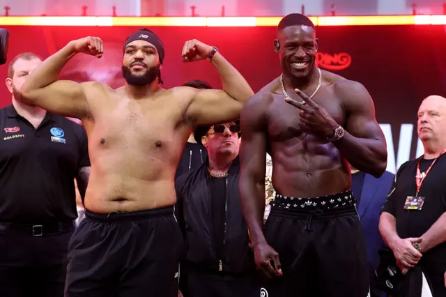 Jeamie 'TKV' Tshikeva and Richard Riakporhe pose for pictures at a weigh-in