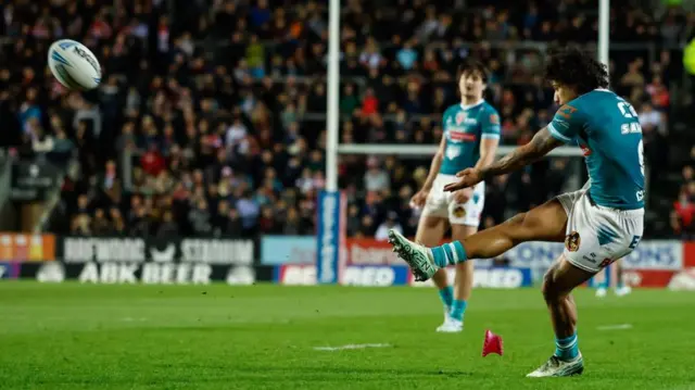 Tristan Sailor kicks a goal for St Helens