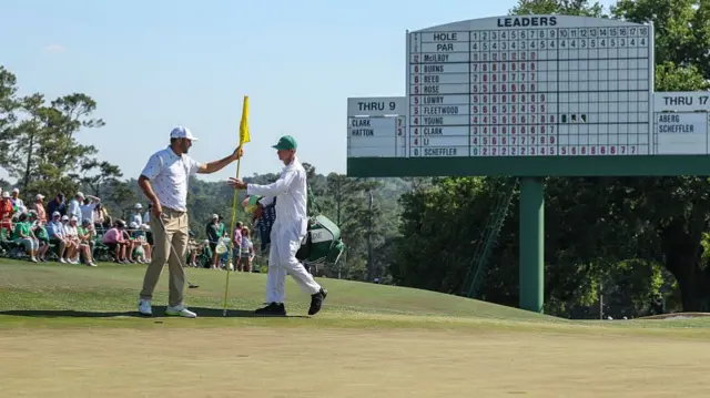 Scottie Scheffler and Ted Scott on day three of The Masters 2026