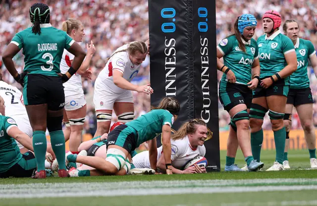 Sarah Bern of England scores her team's second try
