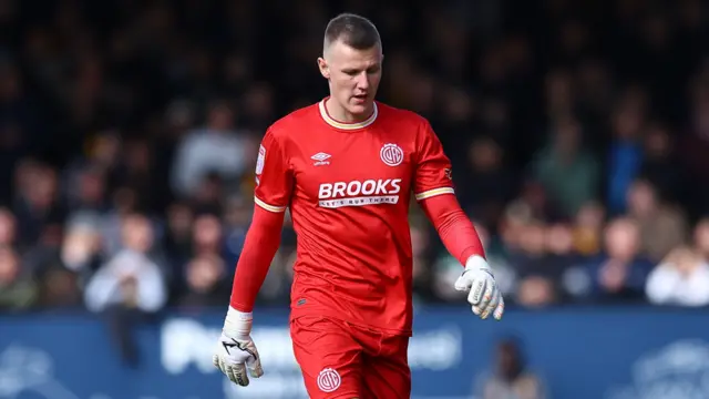 Cambridge goalkeeper Jake Eastwood walks off after being sent off