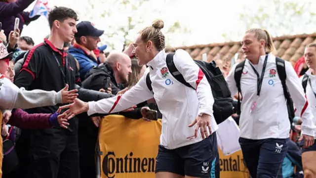 Meg Jones high-fiving fans