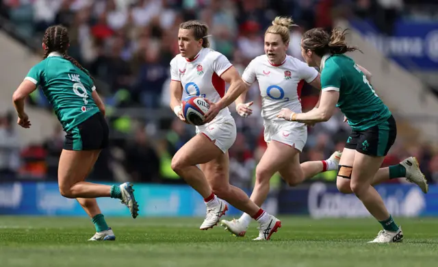 Claudia Moloney-MacDonald of England carries the ball