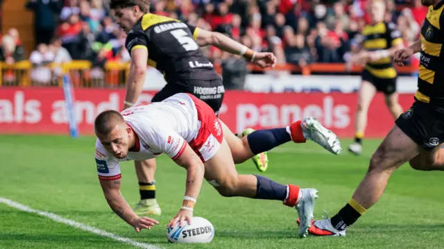 Hull KR's Mikey Lewis touches down to score a try against York Knights