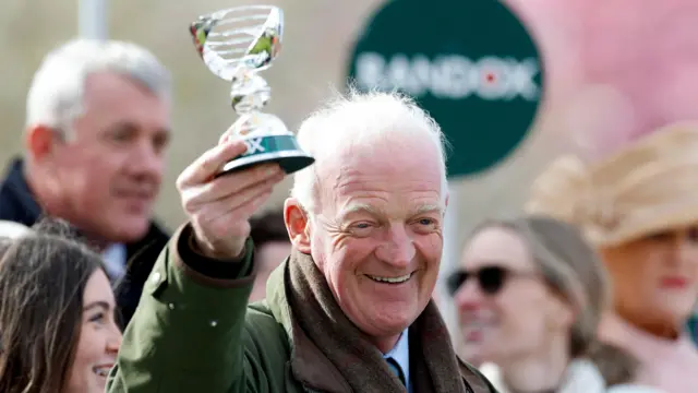 Willie Mullins celebrates with Grand National trophy