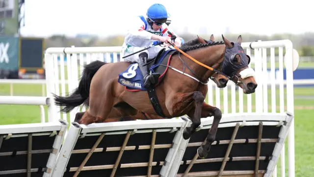Wade Out ridden by Gavin Sheehan on their way to winning the William Hill Handicap Hurdl on Grand National Day of the Randox Grand National Festival 2026 at Aintree Racecourse