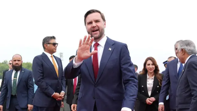 US Vice President JD Vance waves after arriving for talks with Iranian officials in Islamabad