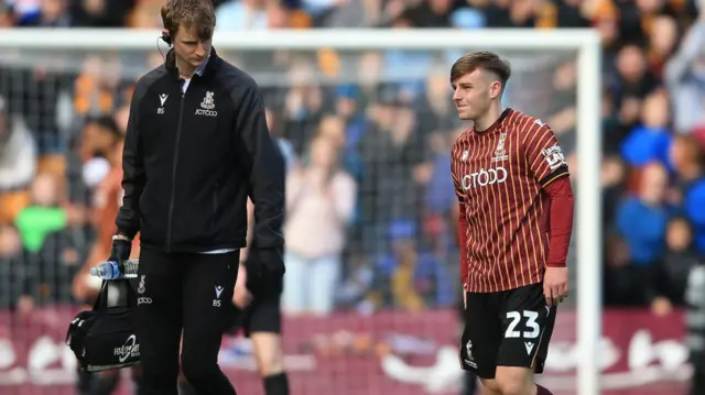 Bobby Pointon of Bradford City is substituted off injured following a heavy tackle.