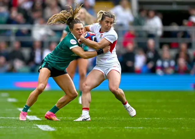 Claudia Moloney-MacDonald of England is tackled by Béibhinn Parsons