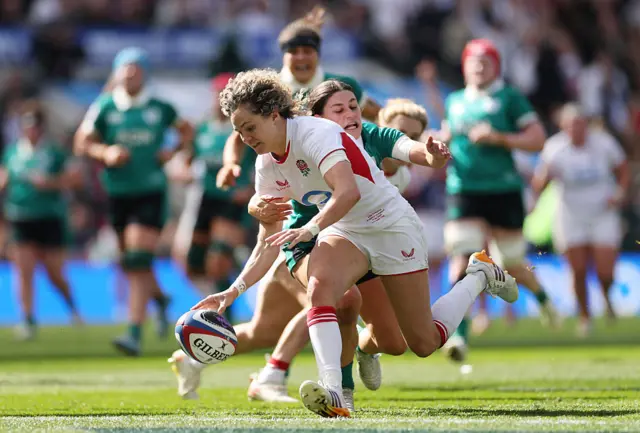 Ellie Kildunne of England scores a try whilst being tackled by Vicky Elmes Kinlan of Ireland which is later disallowed due to a knock on