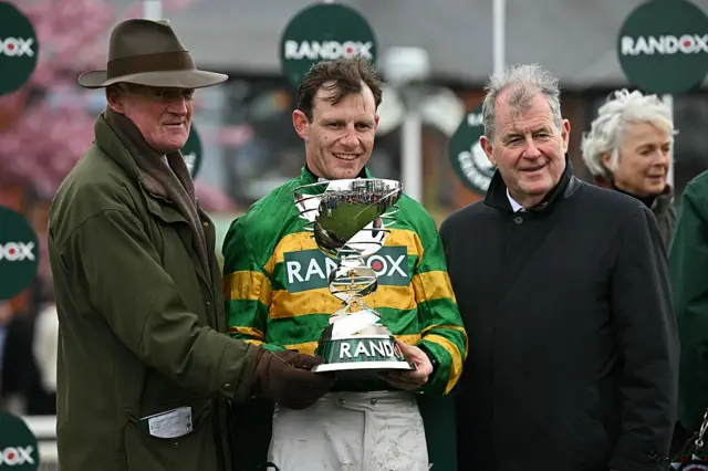 Willie Mullins, Paul Townend and JP McManus celebrate with the Grand National trophy