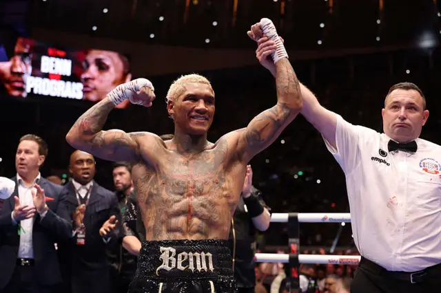 Conor Benn has his arm raised