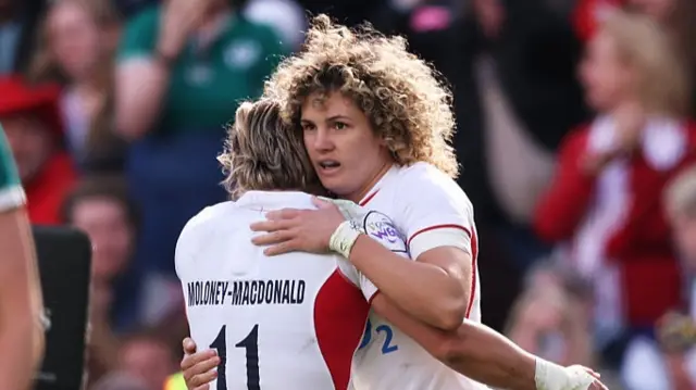 Ellie Kildunne of England celebrates scoring her team's fifth try with team mate Claudia Moloney-MacDonald