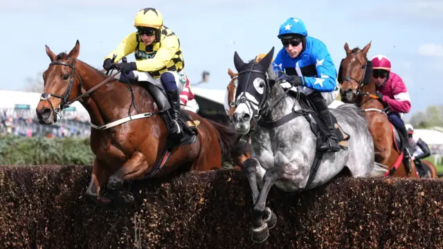 Salvator Mundi ridden by Paul Townend (left) and Be Aware ridden by Harry Skelton during the Hallgarten & Novum Wines Maghull Novices' Chase on Grand National Day of the Randox Grand National Festival 2026 at Aintree Racecourse
