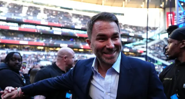 Eddie Hearn holds out his hand