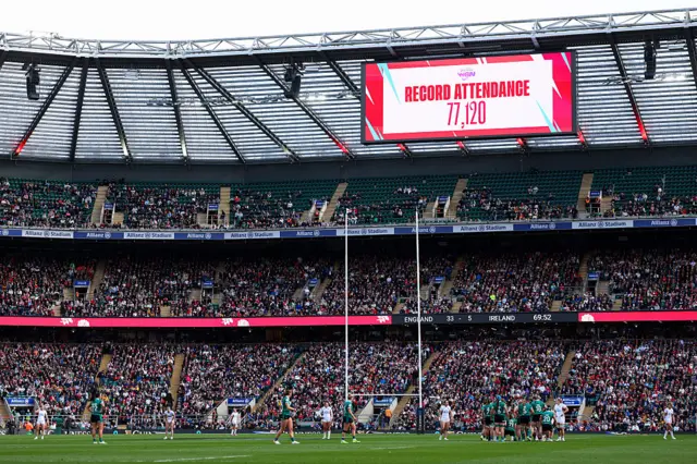 A general view as a LED screen displays the record attendance of 77,120