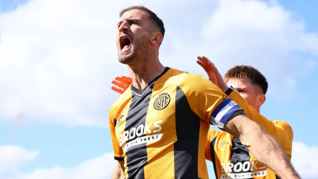 Dominic Ball celebrates putting Cambridge ahead