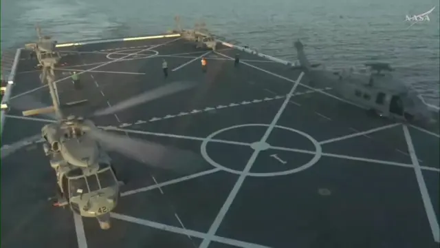 Helicopters aboard the USS John P Murtha shortly after escorting the Orion crew from the module