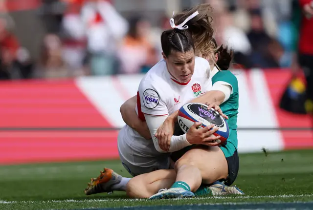 Jess Breach of England scores her team's fourth try