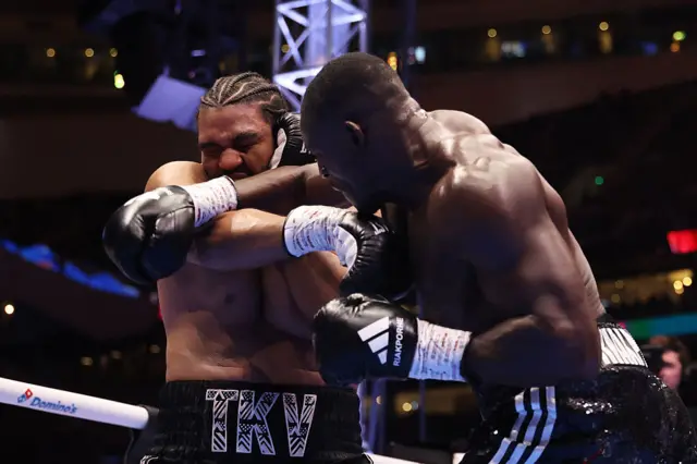Jeamie Tshikeva is punched by Richard Riakporhe