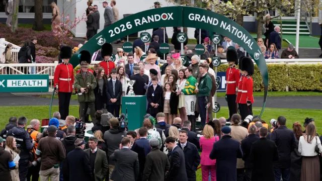 Winning trainer Willie Mullins (left) and jockey Paul Townend celebrate with the trophy alongside winning owner J P McManus after I Am Maximus won the Randox Grand National