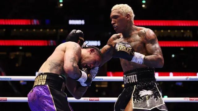 Conor Benn punches Regis Prograis
