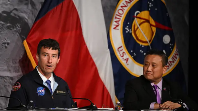 Nasa Orion program manager Howard Hu (right) listen to Nasa flight director Rick Henfling
