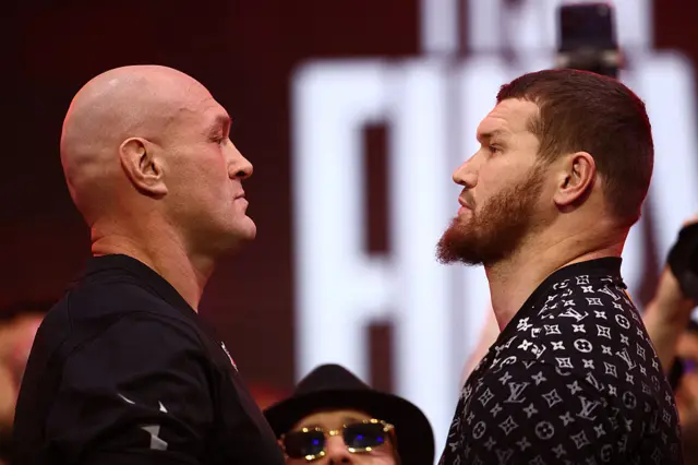 Tyson Fury and Arslanbenk Makhmudov look at each other