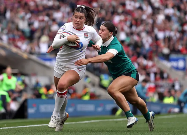 Jess Breach of England is tackled by Vicky Elmes Kinlan of Ireland